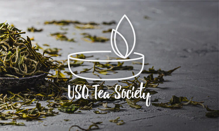 Tea leaves with illustrated tea cup and leaves "USQ Tea Society"