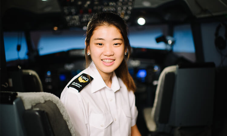 women in cockpit smiling
