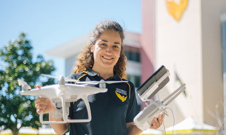 usq lecturer holding a drone