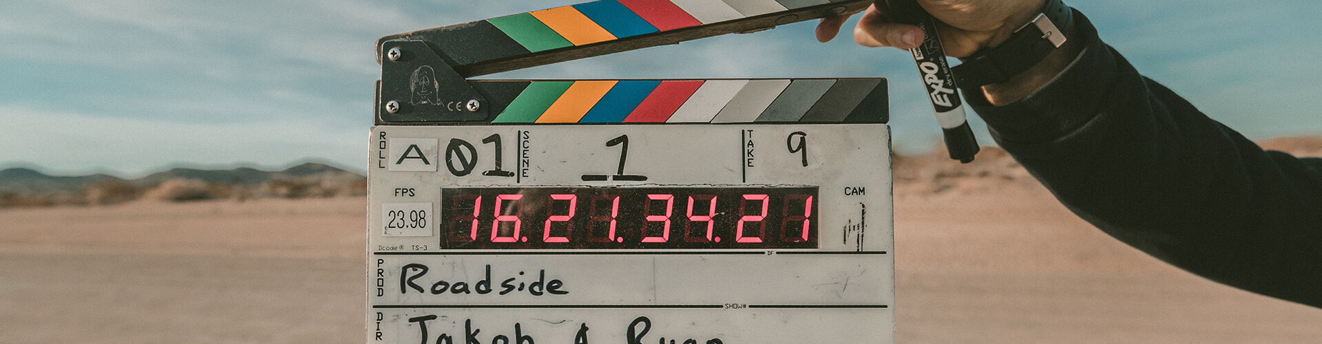 someone holding a clapper on a flim set