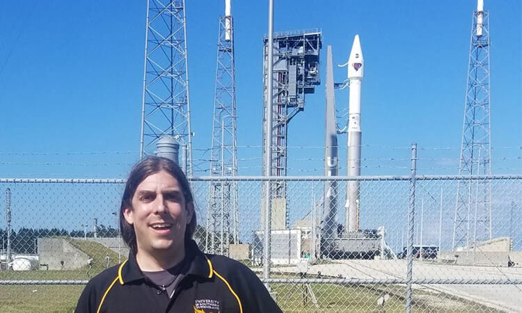 man in front of space ship