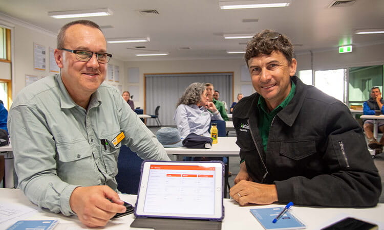 Director of the Centre for Crop Health Professor Levente Kiss shows Matthew Skerman from Nutrien AgSolutions the new app at a recent workshop hosted at the University of Southern Queensland.
